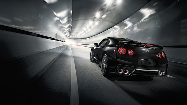2023 Nissan GT-R seen from behind driving through a tunnel | Clay Cooley Nissan Dallas in Dallas TX